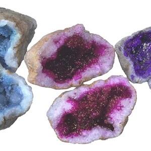 May include: Five geode specimens with different colored crystals inside. The geodes are various sizes and shapes, with some being more rounded and others more angular. The crystals inside are blue, purple, and pink.