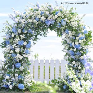 May include: A floral archway, approximately 244 cm wide and 244 cm high, decorated with blue and white flowers. The arch is set against a blue sky and a white picket fence. The text "ArchFlowers W8xH8 ft" is visible.