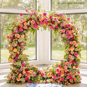 May include: A floral archway, approximately 8 feet wide and 8 feet high, composed of vibrant pink, orange, and red roses, with green foliage. The text "ArchFlowers W8xH8 ft" is visible.