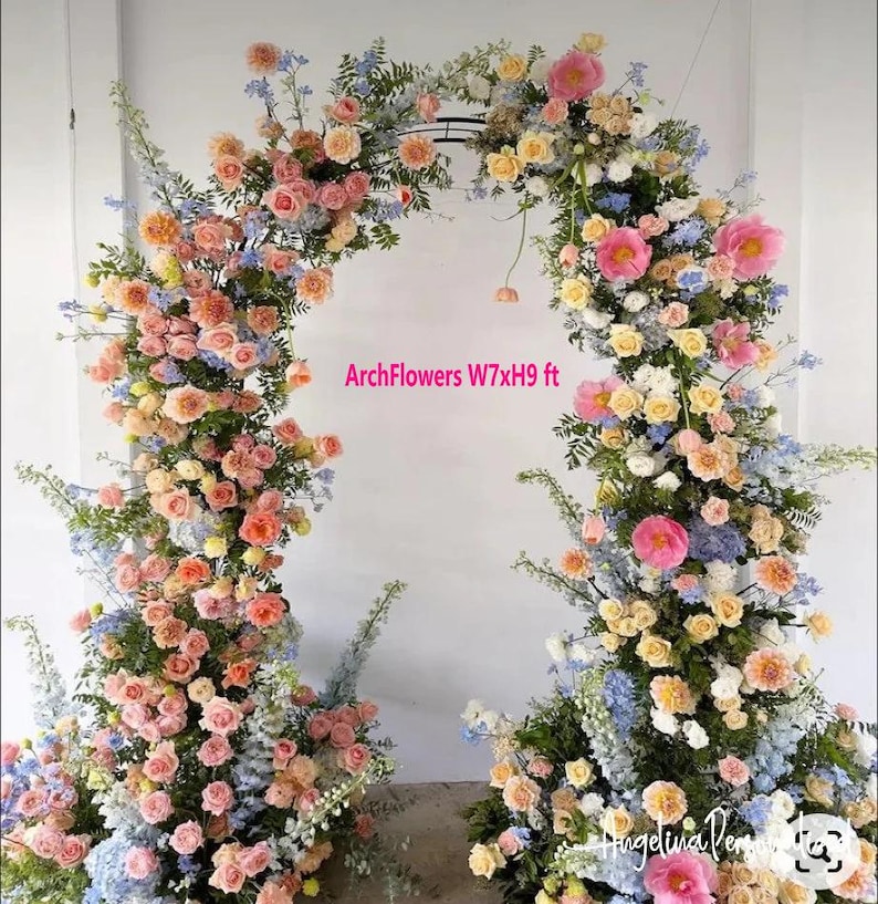 May include: A floral arch made of pink, peach, white, and blue flowers. The arch is 7 feet wide and 9 feet tall. The text "ArchFlowers W7xH9 ft" is visible in the image.