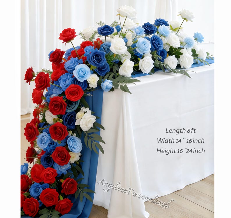 May include: A floral table runner featuring red, white, and blue roses and other flowers. The arrangement is on a white tablecloth with a blue runner. The text on the image says: Length 8 ft, Width 14 ~ 16 inch, Height 16 ~ 24 inch.
