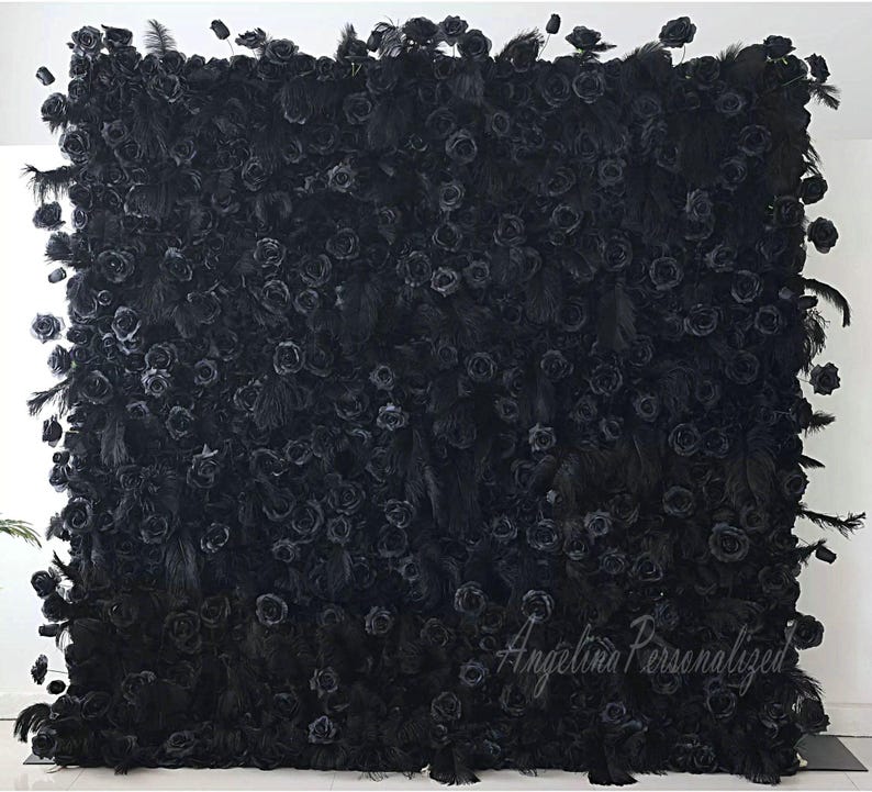 May include: A black backdrop made of artificial roses and feathers. The backdrop is a popular choice for weddings, parties, and photo shoots. The text "Angelina Personalized" is visible in the bottom right corner.