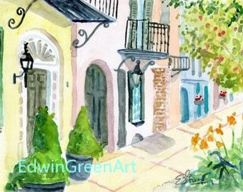 Puede incluir: Pintura acuarela de una fila de casas coloridas con un árbol verde en el fondo. Las casas tienen molduras blancas y balcones negros. Hay plantas en macetas frente a las casas.
