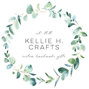 May include: A logo for a business called "Kellie H. Crafts" with the text "est. 2020" and "custom handmade gifts". The logo is surrounded by a wreath of green eucalyptus leaves.