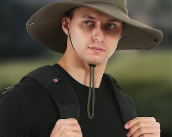 May include: An olive green wide-brimmed sun hat featuring a chin strap with an adjustable toggle. The hat includes text stating "Multi-function sunbonnet" and "Cycling/fishing/mountaineering" with a 12-inch brim measurement graphic.