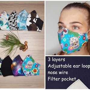 May include: A set of colorful face masks with various patterns, including floral, geometric, and skull designs. The masks are made of three layers of fabric and have adjustable ear loops, a nose wire, and a filter pocket.