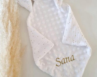 White gauze comforter with gold polka dots