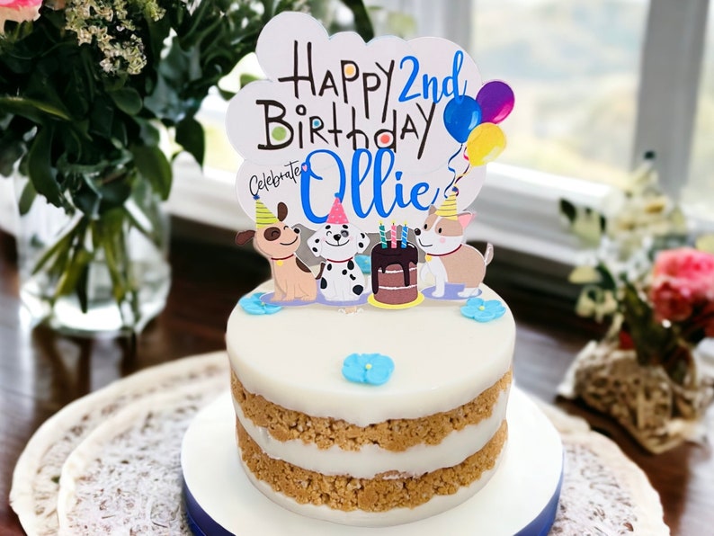 Peanut butter dog cake with printed topper and blue flowers