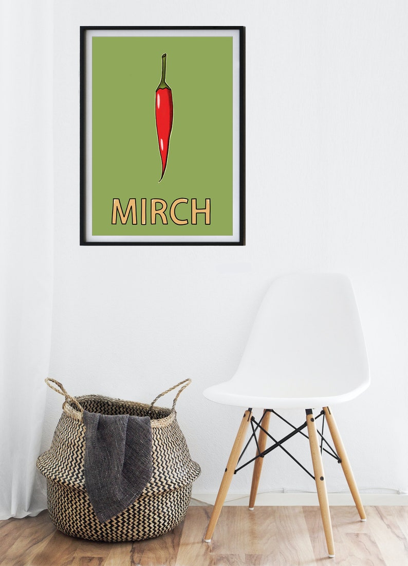 May include: A framed print with a green background and a red chili pepper illustration. The word "MIRCH" is written in orange below the pepper.