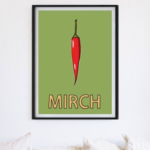 May include: A framed print with a green background featuring a red chili pepper and the word "MIRCH" in orange.