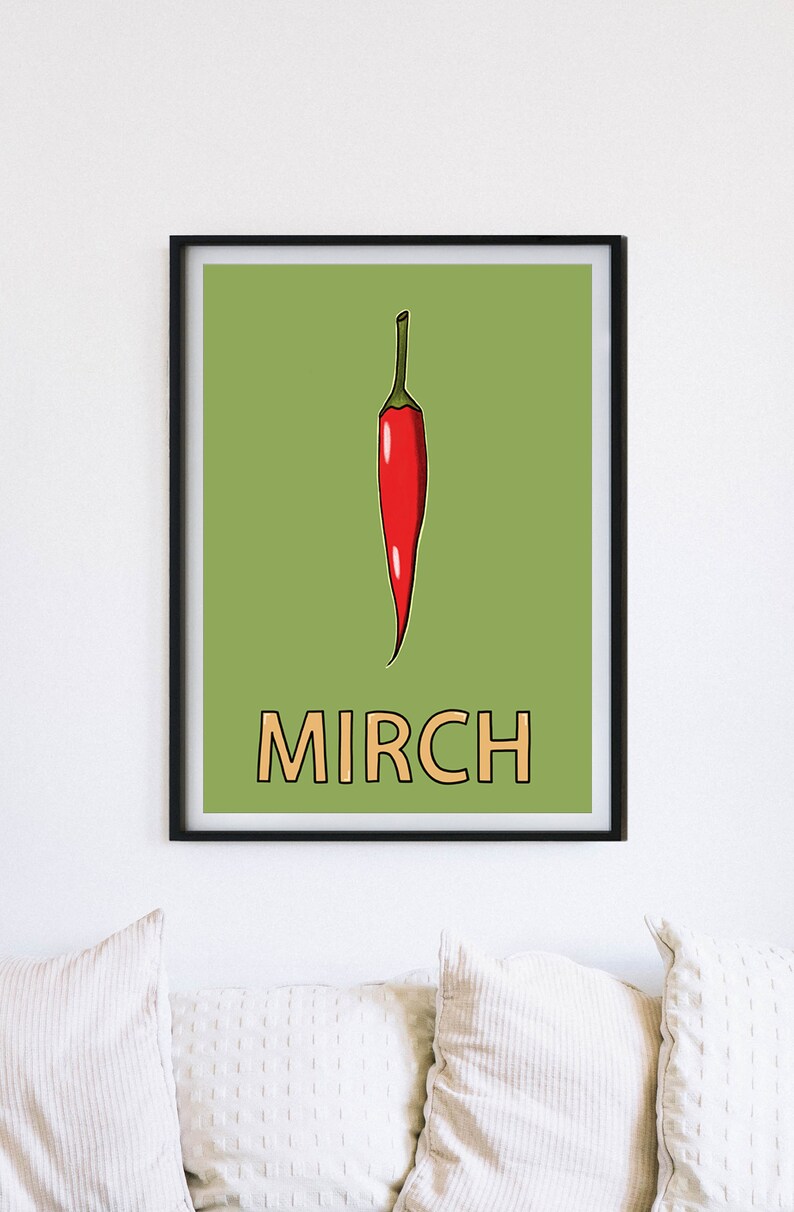 May include: A framed print with a green background featuring a red chili pepper and the word "MIRCH" in orange.