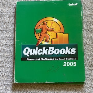 May include: A green QuickBooks software box with the Intuit logo. The cover features a running orange figure carrying a green folder, with the text "QuickBooks Financial Software for Small Business 2005."