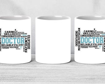 May include: White ceramic mug with the word "DOCTOR" in teal, surrounded by words like "caring," "skilled," and "compassionate." The mug is a standard size and has a curved handle.