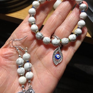 Howlite bead stretch bracelet and earring set w/evil eye and yin Yang charm. Silver toned & colored glass findings. It has all the feels.