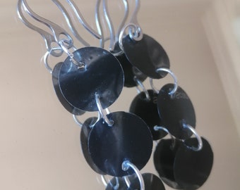 Design earrings made with recycled x-ray radiography materials