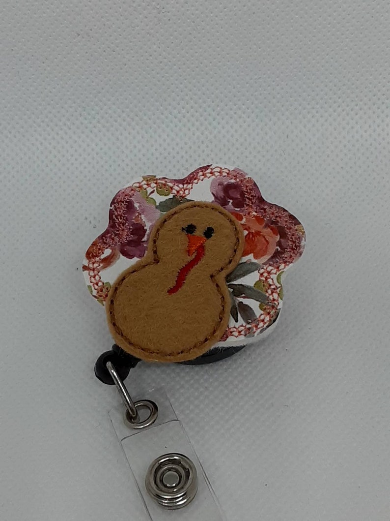 Turkey with Floral Feathers Badge Reel