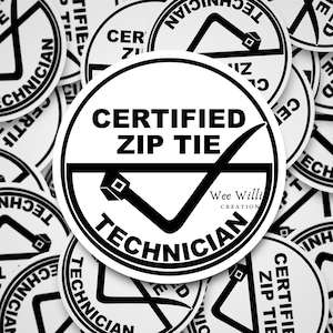 May include: A black and white sticker with the text "CERTIFIED ZIP TIE TECHNICIAN" and a checkmark graphic. The text "Wee Willi CREATION" is also included.