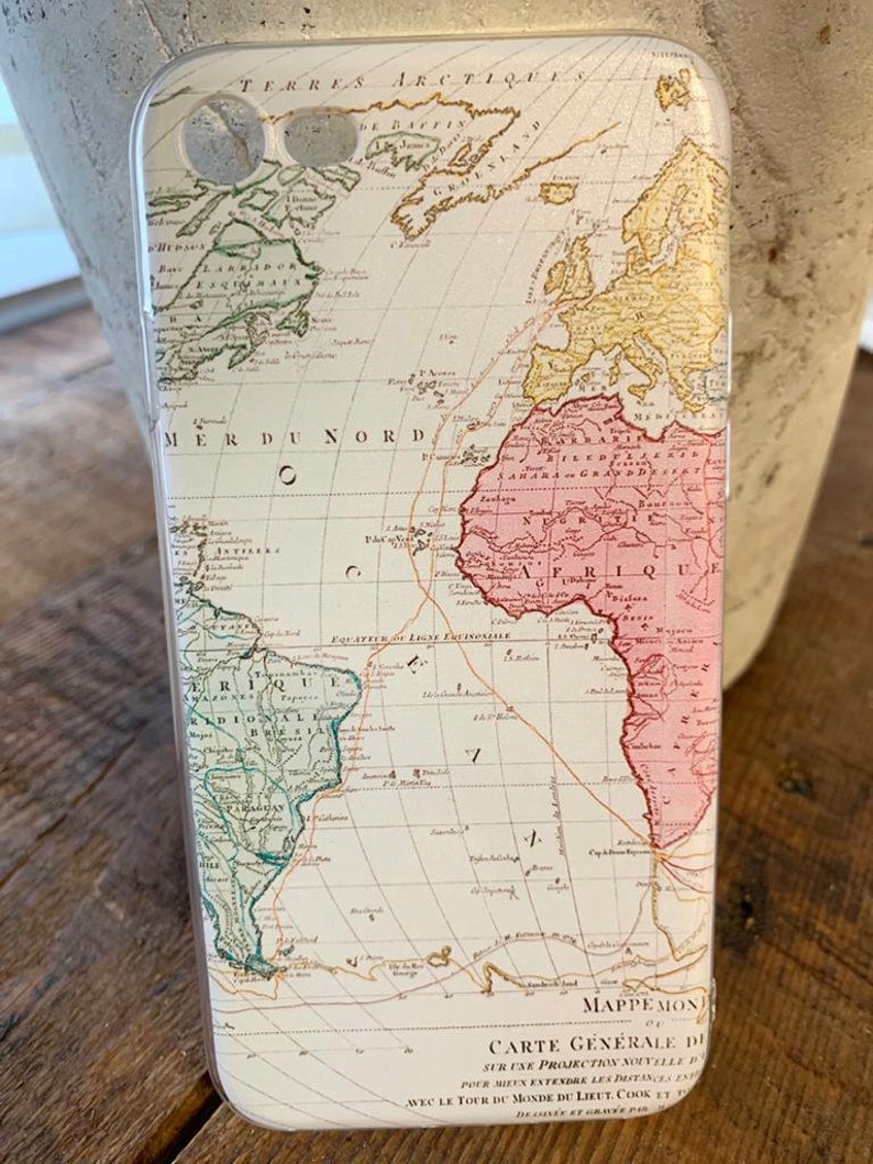 May include: A white phone case with a vintage world map design. The map is in shades of green, yellow, pink, and brown. The map includes the text "TERRES ARCTIQUES" and "MER DU NORD".