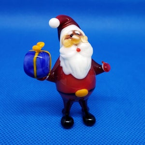 Santa Claus with a gift, Blown glass, Art glasst, Santa Claus collection, Glass Santa miniature, Toys gift, Murano glass, Christmas Gift