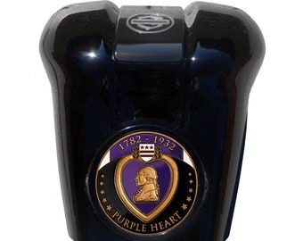 May include: Black motorcycle gas cap with a gold and purple Purple Heart emblem. The emblem features a profile of George Washington and the text "1782 - 1932" and "Purple Heart".