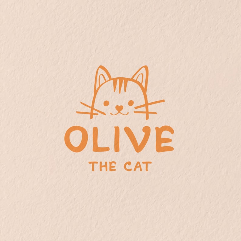 K&ouml;nnte beinhalten: Eine einfache Illustration eines Katzenkopfes mit dem Namen "OLIVE THE CAT" darunter.