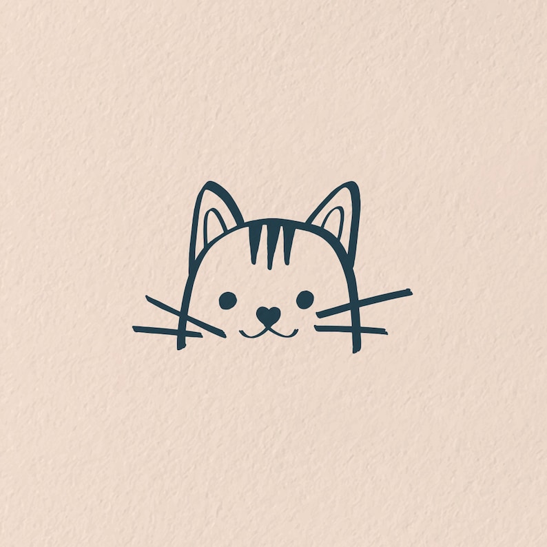 K&ouml;nnte beinhalten: Eine einfache Linienzeichnung eines Katzenkopfes mit Schnurrhaaren. Die Katze hat schwarze Augen und eine herzf&ouml;rmige Nase.