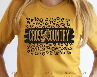 May include: A yellow t-shirt with a black and gold "Cross Country" design featuring a running shoe with wings. The design is surrounded by a leopard print pattern.