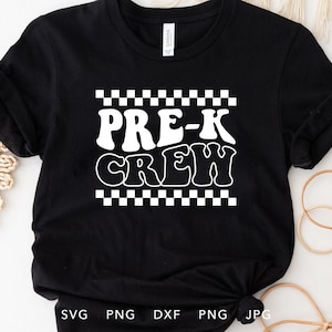 May include: Black t-shirt with white text that says "Pre-K Crew" in a retro font. The text is surrounded by a checkered pattern.