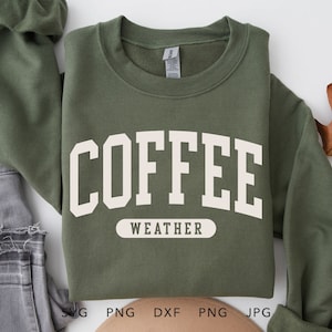 May include: A green sweatshirt with white text that reads "COFFEE WEATHER".