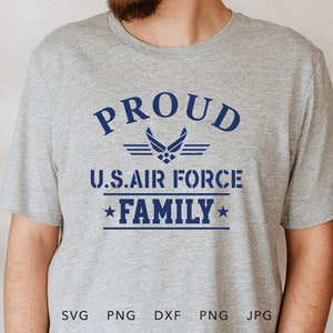 May include: Grey t-shirt with a blue graphic that says "PROUD U.S. AIR FORCE FAMILY" with a star on either side of the word "FAMILY". The graphic also includes a blue Air Force emblem.