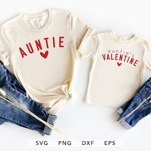 May include: Two cream-colored t-shirts with red text and a heart graphic. One shirt says "AUNTIE" and the other says "auntie's VALENTINE". Both shirts are paired with blue jeans. The image includes SVG, PNG, DXF, and EPS file type logos.