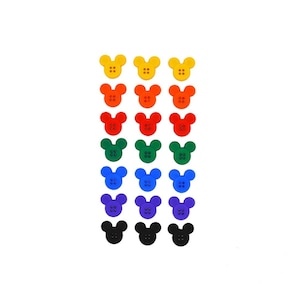 May include: A set of 18 colorful Mickey Mouse shaped buttons. The buttons are arranged in a rainbow pattern, starting with yellow and ending with black.