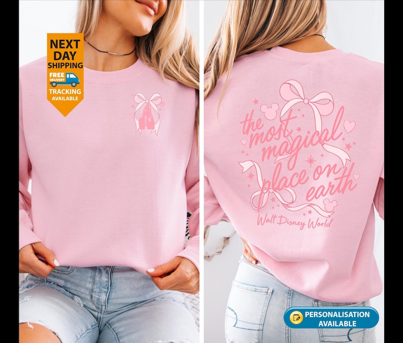 May include: A light pink sweatshirt with a bow and the text "the most magical place on earth" in pink. The sweatshirt has a small bow graphic on the front. Walt Disney World is printed below the text.