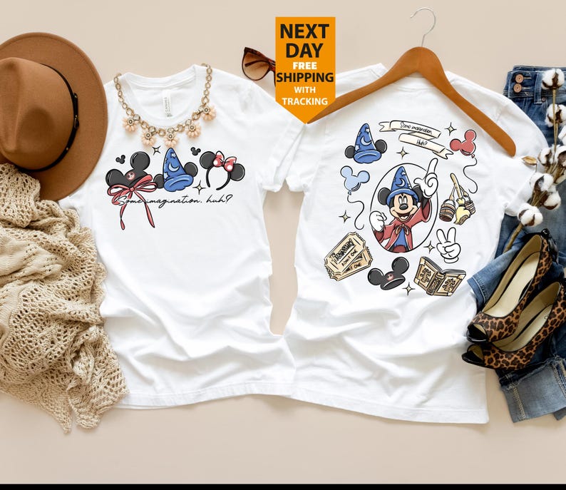 May include: Two white t-shirts with Disney-themed graphics. One shirt features Mickey Mouse ears, a Sorcerer's hat, and Minnie Mouse ears with the text "Some imagination, huh?". The other shirt has a Mickey Mouse graphic with various Disney icons.