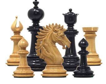 May include: A set of chess pieces, including a knight, bishop, pawn, and rook. The pieces are made of wood and have a natural finish. The knight is carved in the shape of a horse's head. The bishop is a tall, pointed piece with a rounded top. The pawn is a simple, rounded piece. The rook is a tall, square piece with a rounded top.