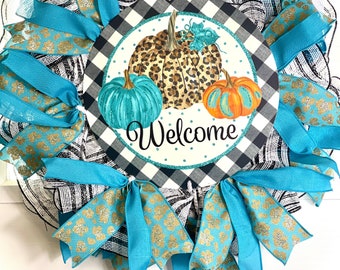 Teal and pumpkin wreath! Can’t beat the color combo for fall, thin wreath for between the doors, fun and eye catching wreath for fall