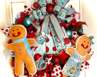 Gingerbread wreath, gingerbread attachments, gingerbread couple, pine wreath, ice blue and red ribbon, quality ribbon, fun whimsical wreath