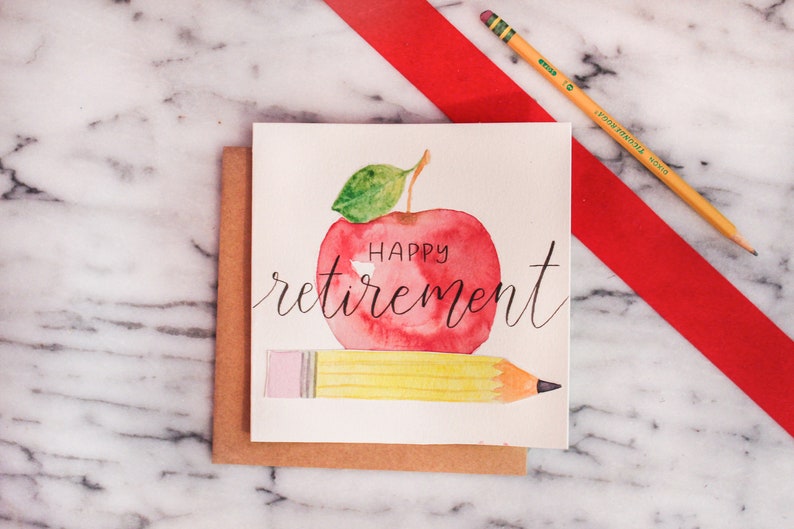 May include: A watercolor card with a red apple and a yellow pencil. The apple has the words "Happy retirement" written on it.