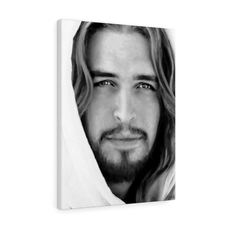 May include: Black and white portrait of a man with long hair and a beard. He is wearing a white robe and looking directly at the viewer.