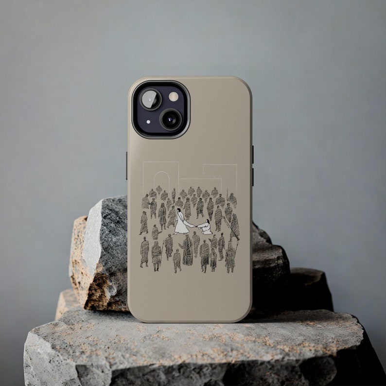 May include: A beige phone case with a black and white illustration of a wedding scene. The illustration shows a bride and groom in the center of a crowd of people.