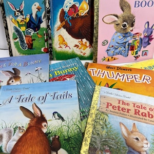 May include: A collection of vintage children's books featuring bunny rabbits. The books include "Rabbit and His Friends", "The Little Red Hen", "The Bunny Book", "Time for a Bunny", "A Bunny", "A Tale of Tails", and "The Tale of Peter Rabbit".