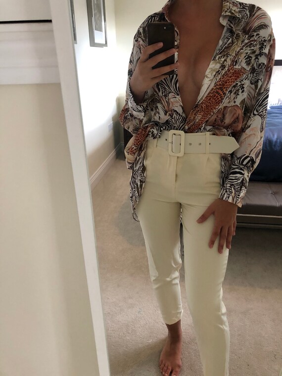 white high waisted belted trousers