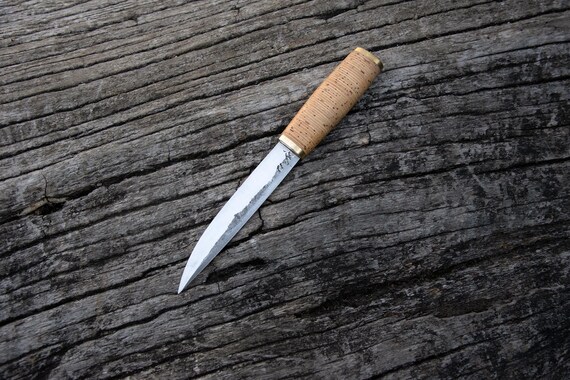 A hand-forged Finnish puukko with centuries of Nordic tradition behind it — carbon steel, clean Scandinavian lines, and actually useful as a bushcraft and woodworking tool.