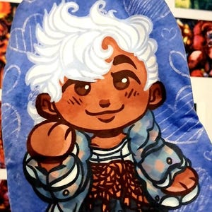 May include: A blue, cartoon-style illustration of a character with white hair and brown skin. The character wears a blue jacket over a striped shirt and a patterned skirt. The background is blue with white cloud and heart designs.