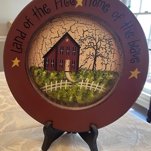 Primitive, Americana, hand painted salt box plate with stars “Land of the Free Home of The Brave” (measurements are in photos)