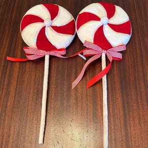 Faux Lollipops in Red/white stripes tied with red ribbons tied at top(measurements are in photos)