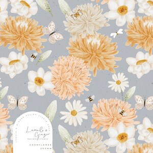 May include: A seamless pattern featuring watercolour illustrations of cornflowers, daisies, butterflies, and bees on a light blue background. The pattern is titled "Cornflower" and is 200mm in size. The design is by Lumie & Ginger Design Studio.