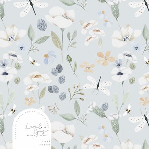 May include: A light blue fabric pattern featuring white flowers, green leaves, small blue blossoms, dragonflies, and bees. An arched white logo overlay in the bottom left corner displays the text Lumelo & Ginger Design Studio 2023 Lake 200mm.