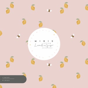 May include: A light pink background with a repeating pattern of lemons and bees. The center of the image features a white circle with the text "MINIS FROM Lumelo & Ginger DESIGN STUDIO" in black text. The text "LEMON FLOS5" is in a gray rectangle at the bottom left of the image.