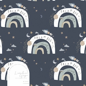 May include: A seamless pattern featuring a white rainbow with the text "Dream Big...always" in a blue and white font. The rainbow is decorated with a rocket, stars, and clouds on a dark blue background.